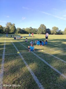 Beavers playing games at the park