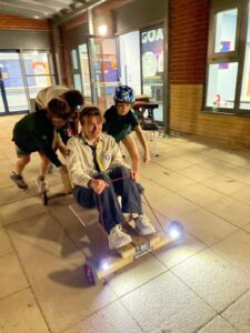 Akela driving the Cubmobile